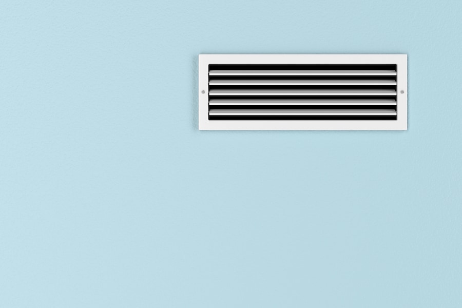 Air conditioning vent on the blue wall.