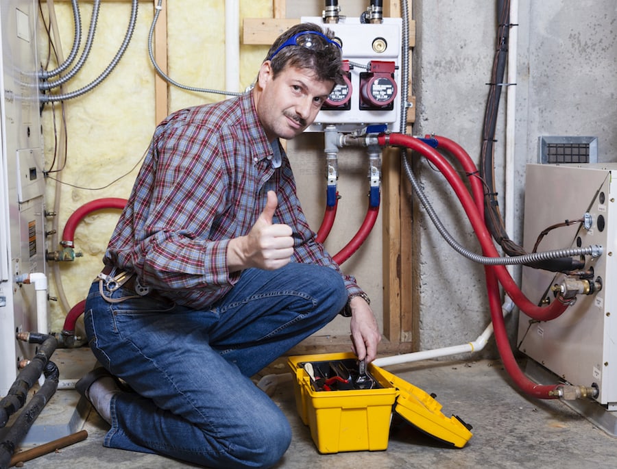 Happy handyman showing thumbs up.