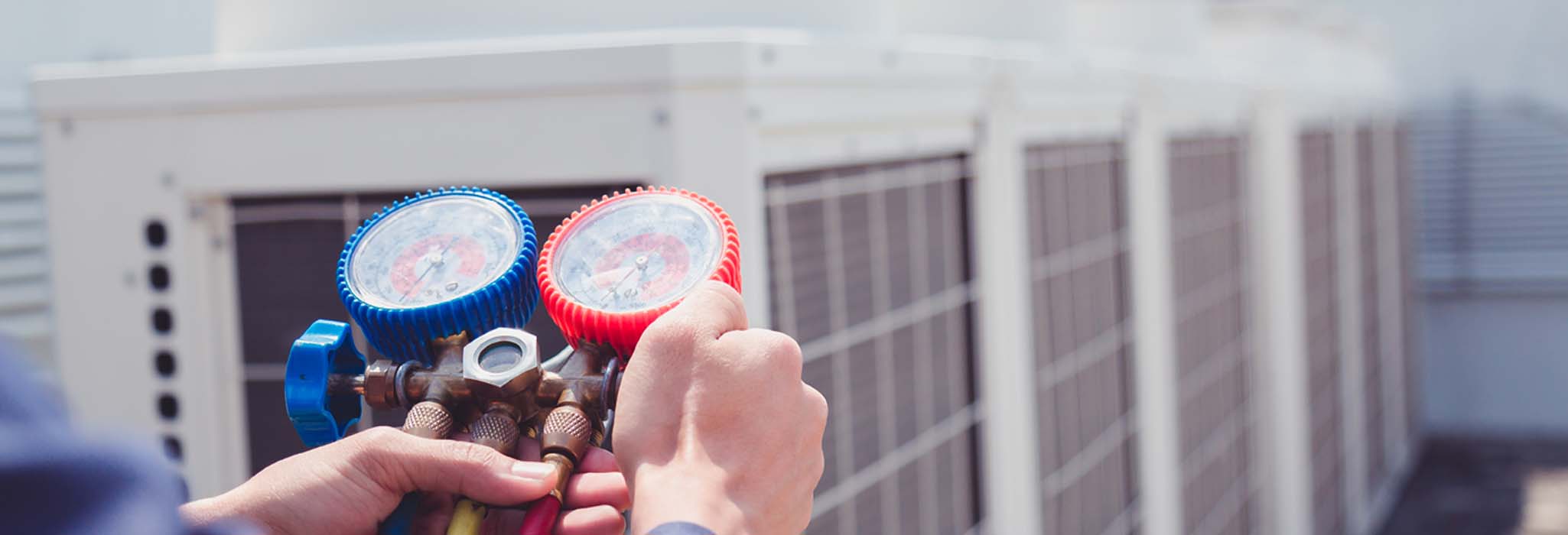 Technician is checking air conditioner ,measuring equipment for filling air conditioners.