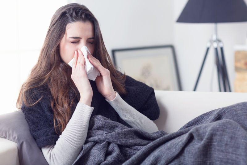 Woman Sneezing