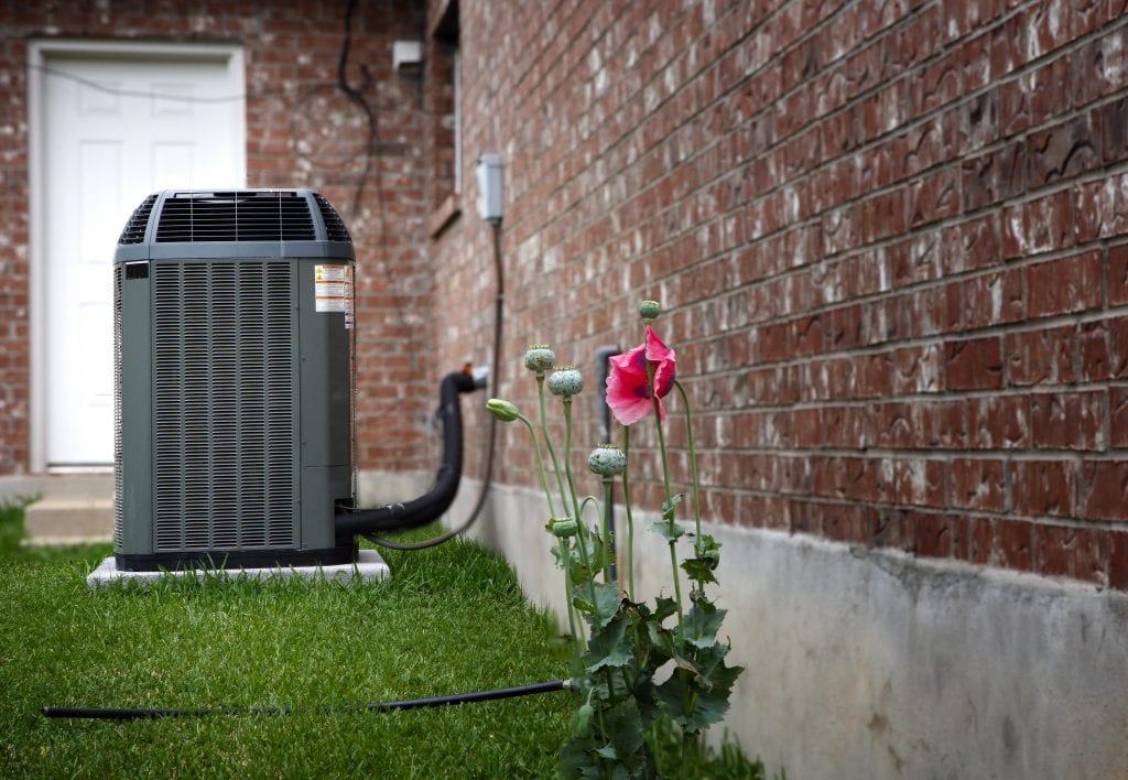 Chemical Wash needs to be done on this air conditioner condenser sitting outside of a Weiser, ID home.