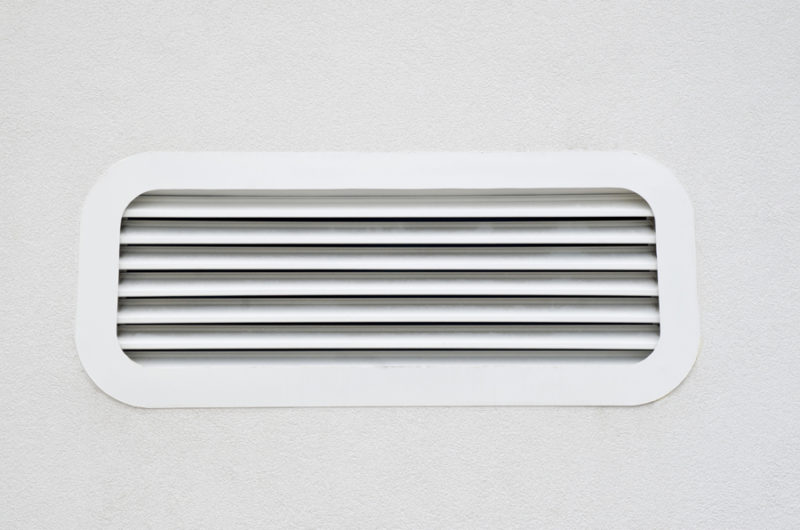 New white air scrubber vent on wall closeup in Weiser, ID