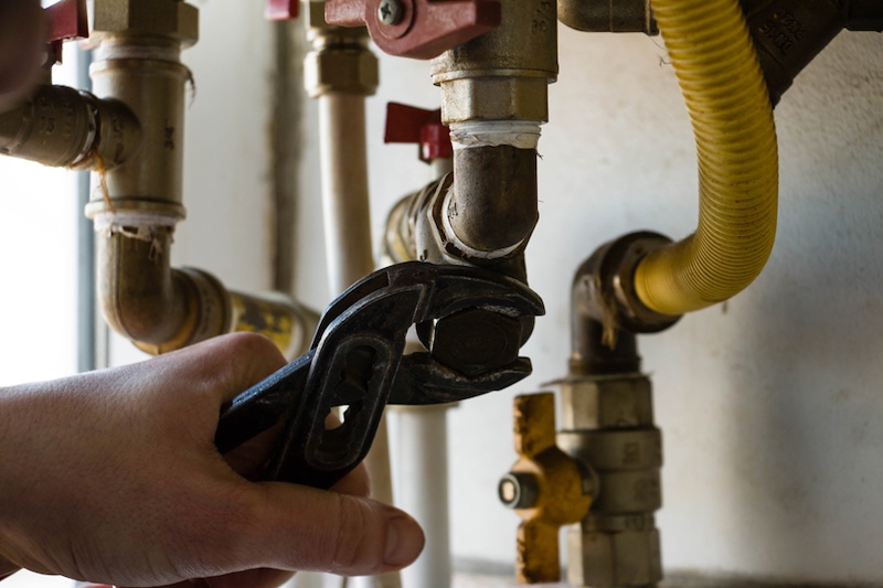 boilers being repaired by a person