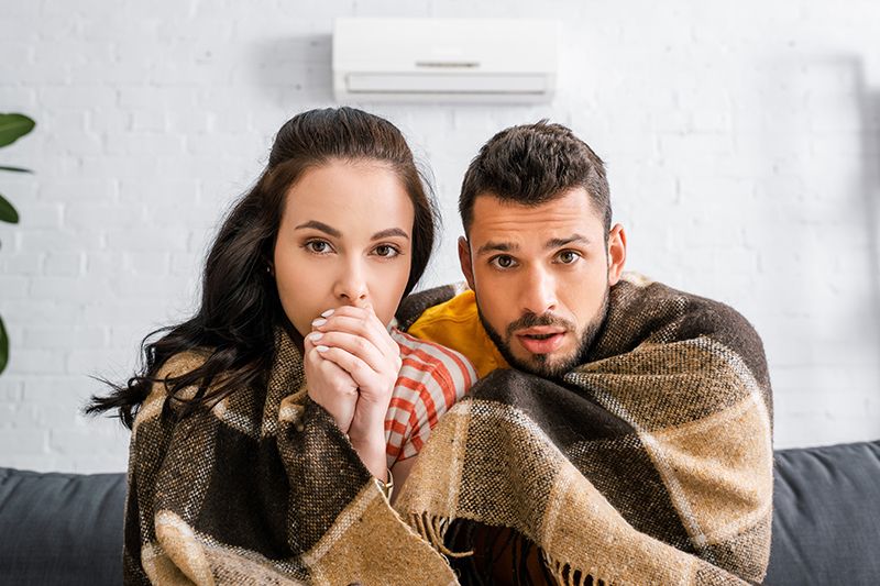 The Basics of Winter Indoor Air Quality - Couple Under a Blanket.