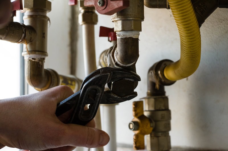 boilers being repaired by a person