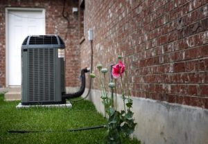 Chemical Wash needs to be done on this air conditioner condenser sitting outside of a Weiser